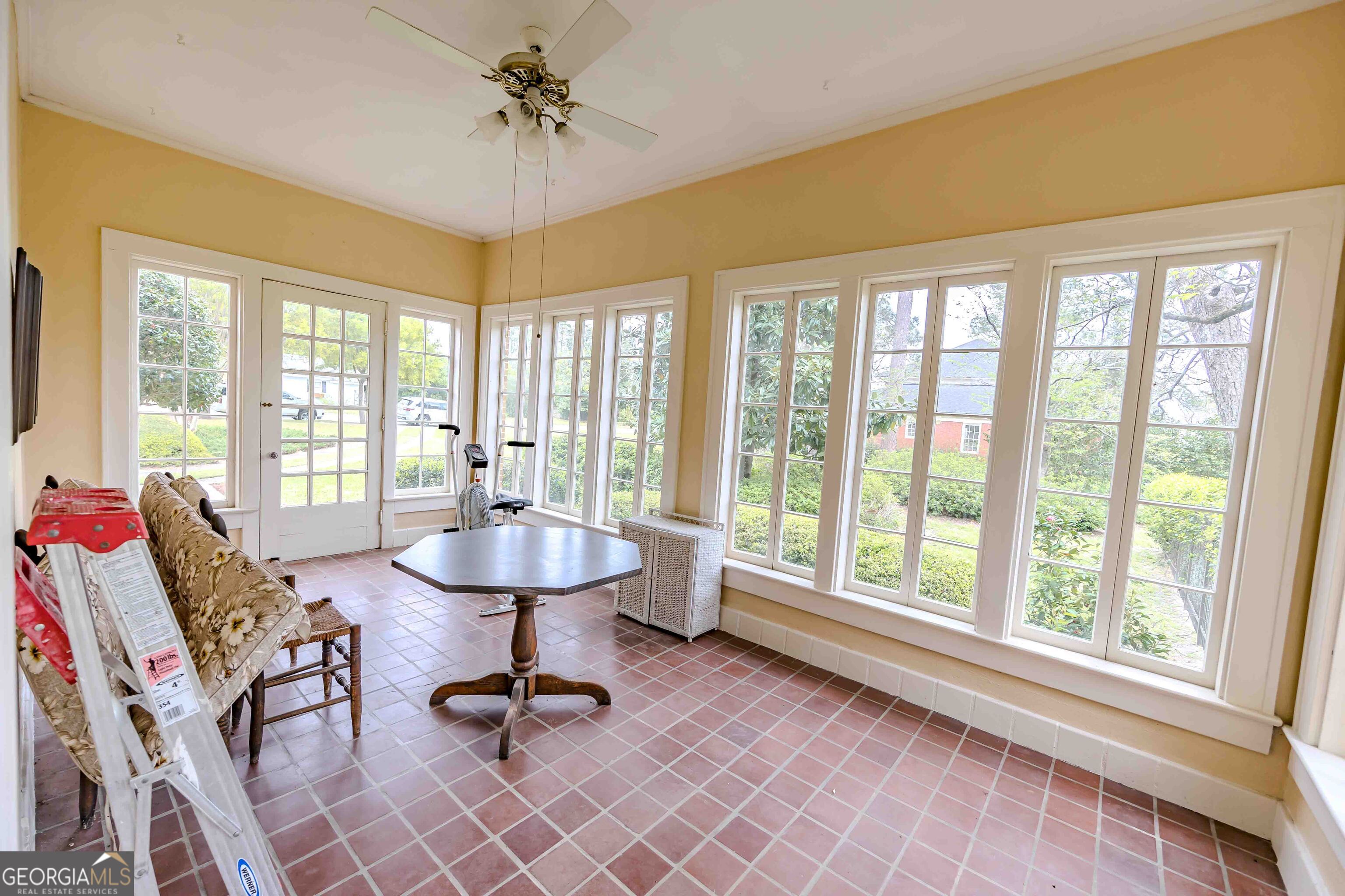 39 West Graham Street McRae-Helena, GA 31055 - Photo 14 of 107 a living room with furniture and floor to ceiling windows