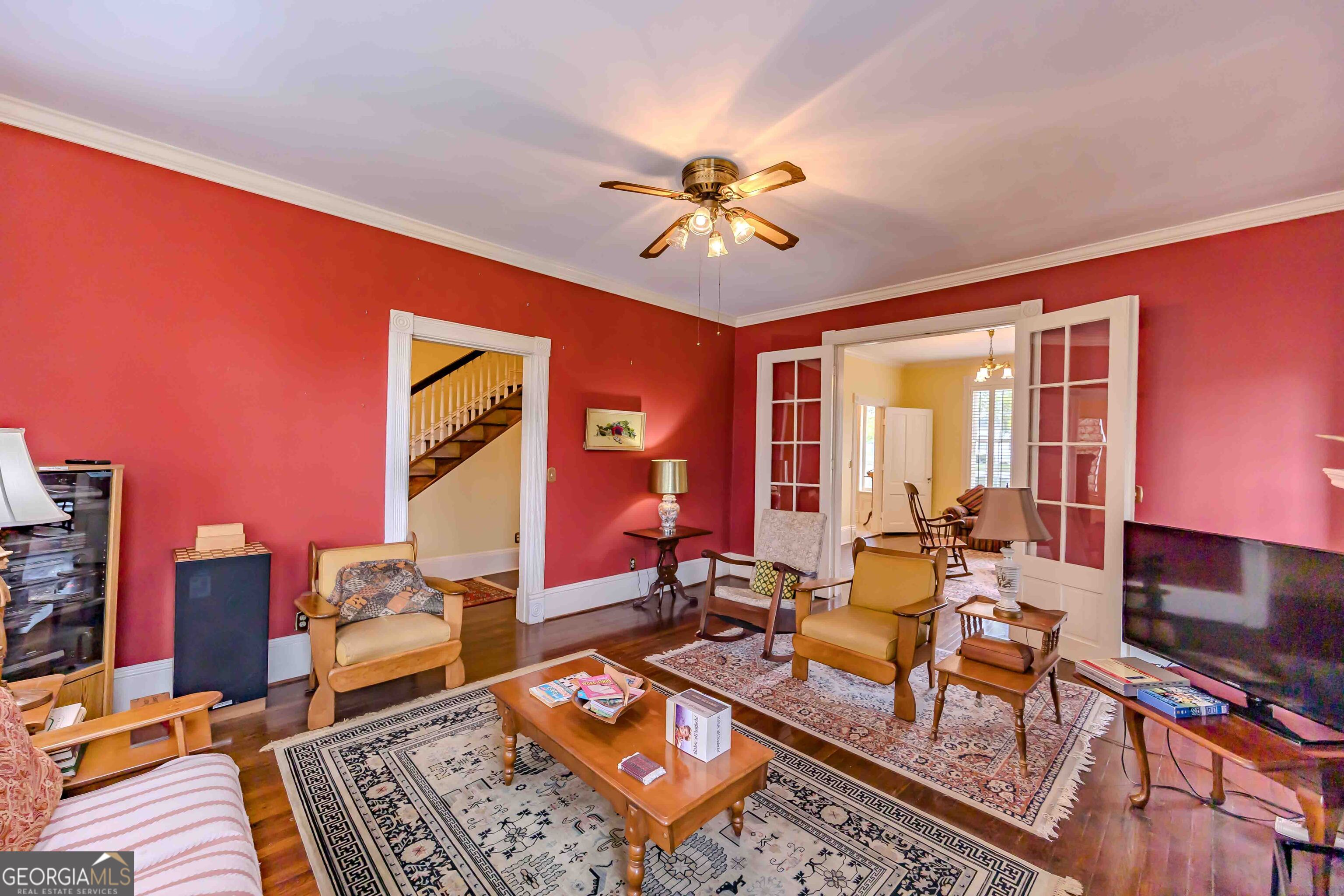 39 West Graham Street McRae-Helena, GA 31055 - Photo 17 of 107 a living room with furniture a bookshelf and a window