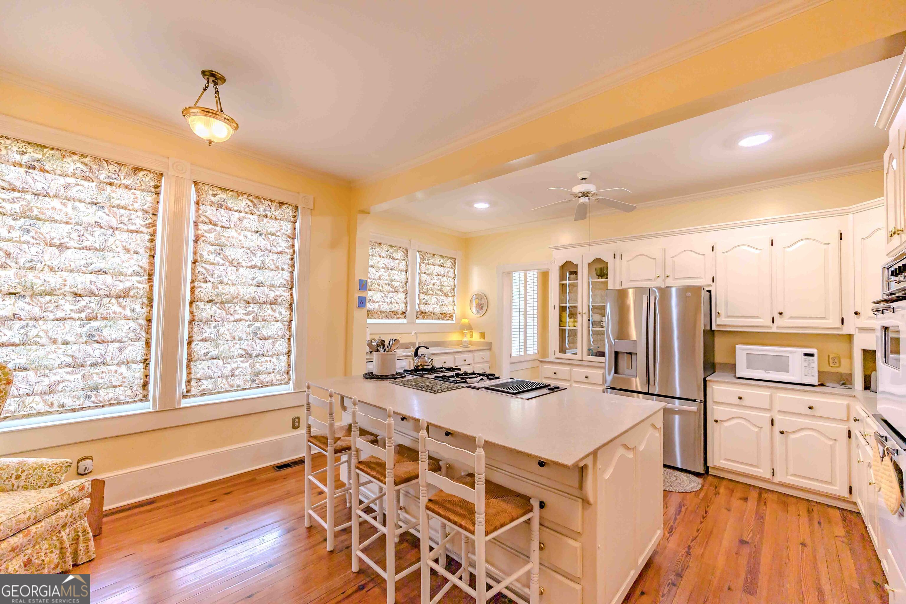 39 West Graham Street McRae-Helena, GA 31055 - Photo 27 of 107 a kitchen with stainless steel appliances kitchen island granite countertop a stove and a refrigerator