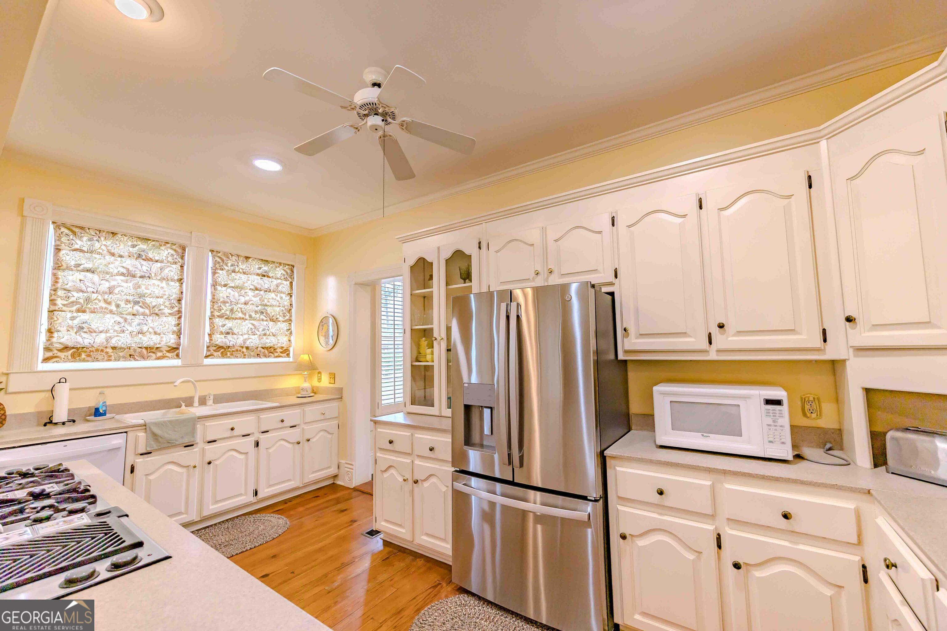 39 West Graham Street McRae-Helena, GA 31055 - Photo 31 of 107 a kitchen with stainless steel appliances a refrigerator sink and cabinets