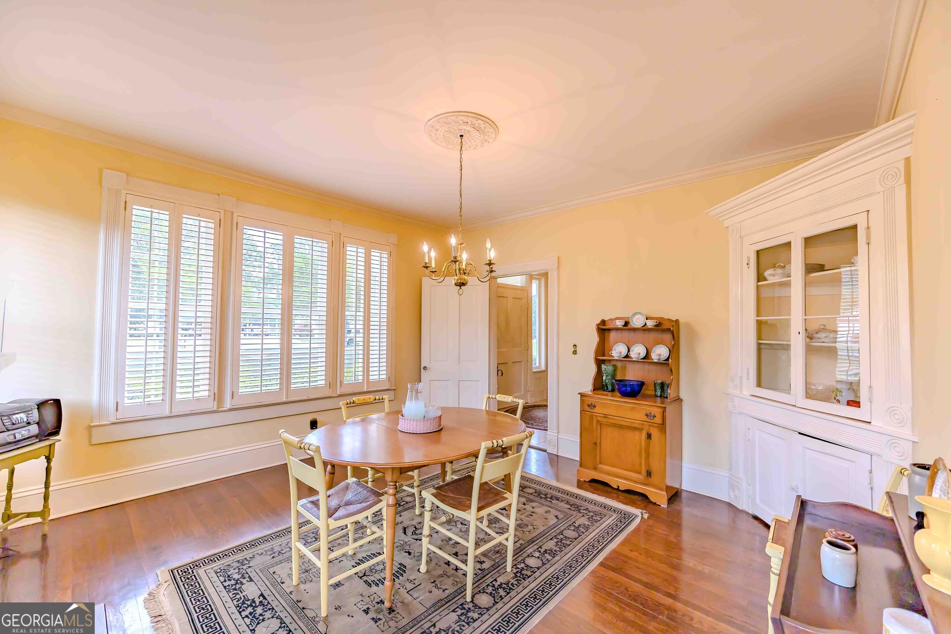 39 West Graham Street McRae-Helena, GA 31055 - Photo 36 of 107 a dining room with furniture a chandelier and wooden floor