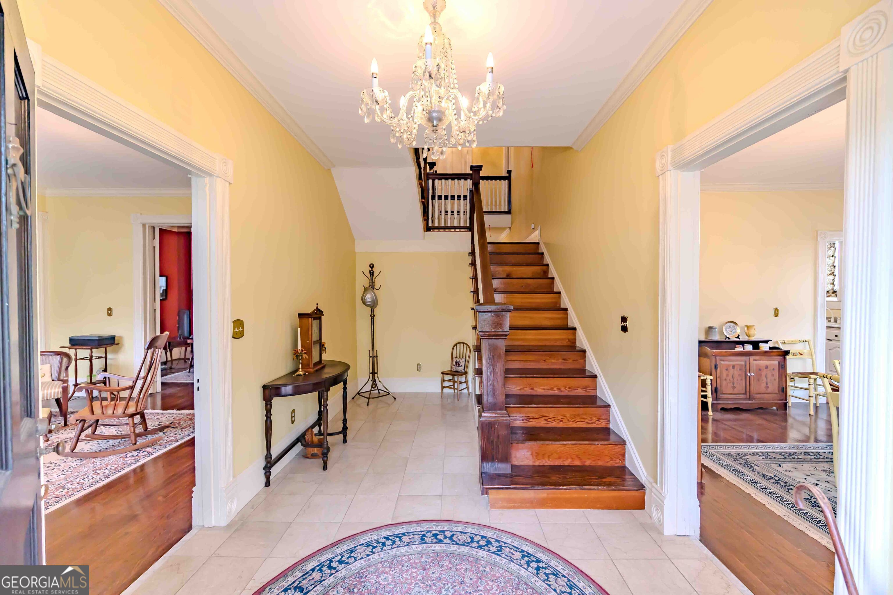 39 West Graham Street McRae-Helena, GA 31055 - Photo 4 of 107 a view of a hallway with wooden floor and staircase