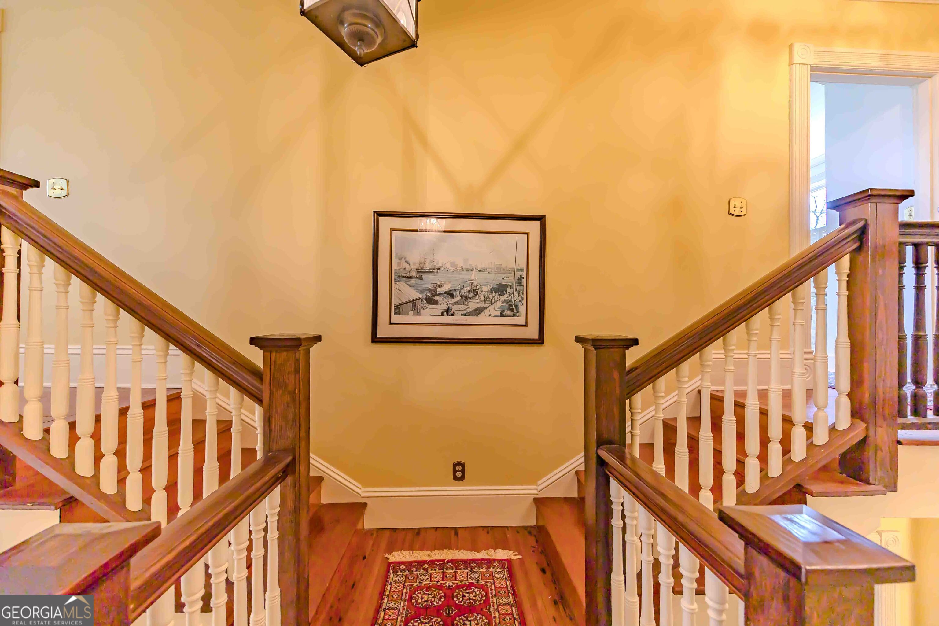 39 West Graham Street McRae-Helena, GA 31055 - Photo 41 of 107 a view of staircase with wooden floor and a window