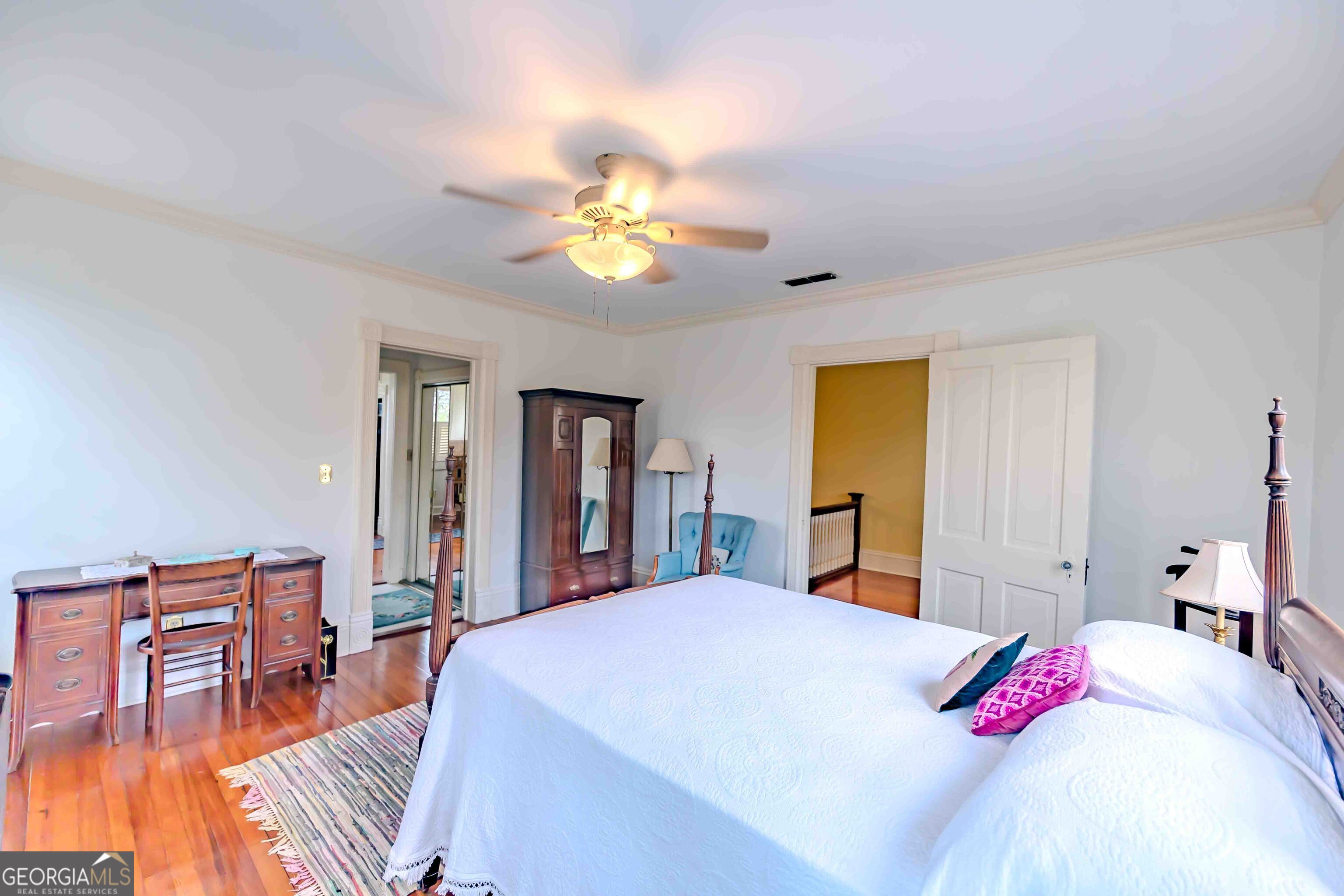 39 West Graham Street McRae-Helena, GA 31055 - Photo 48 of 107 a bed room with a bed and a chandelier