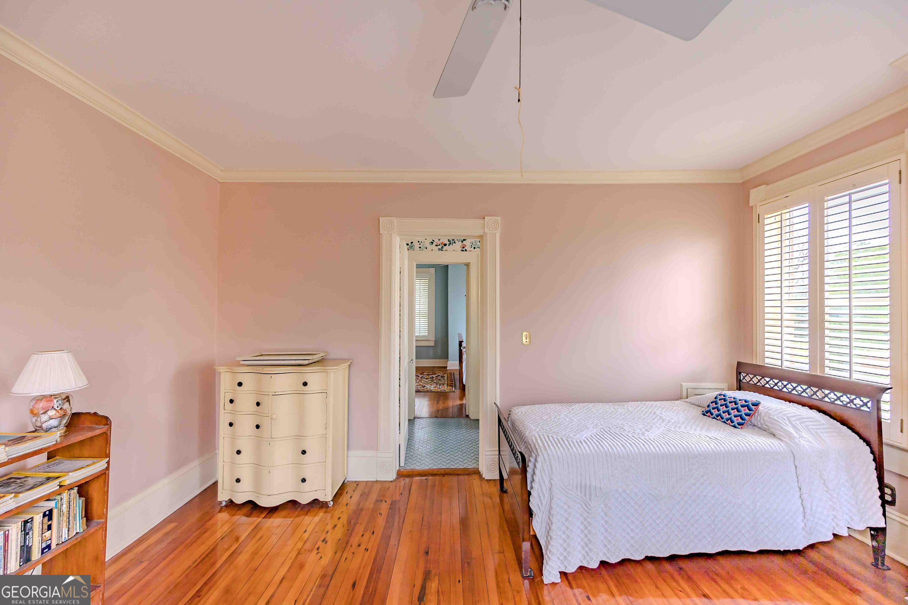 39 West Graham Street McRae-Helena, GA 31055 - Photo 66 of 107 a bedroom with a bed and wooden floor