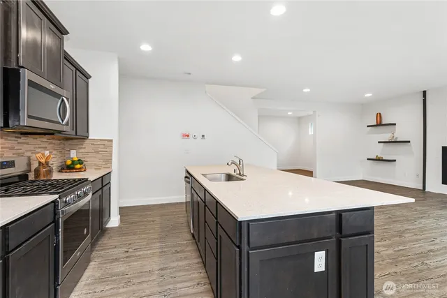 a kitchen with a sink and cabinets