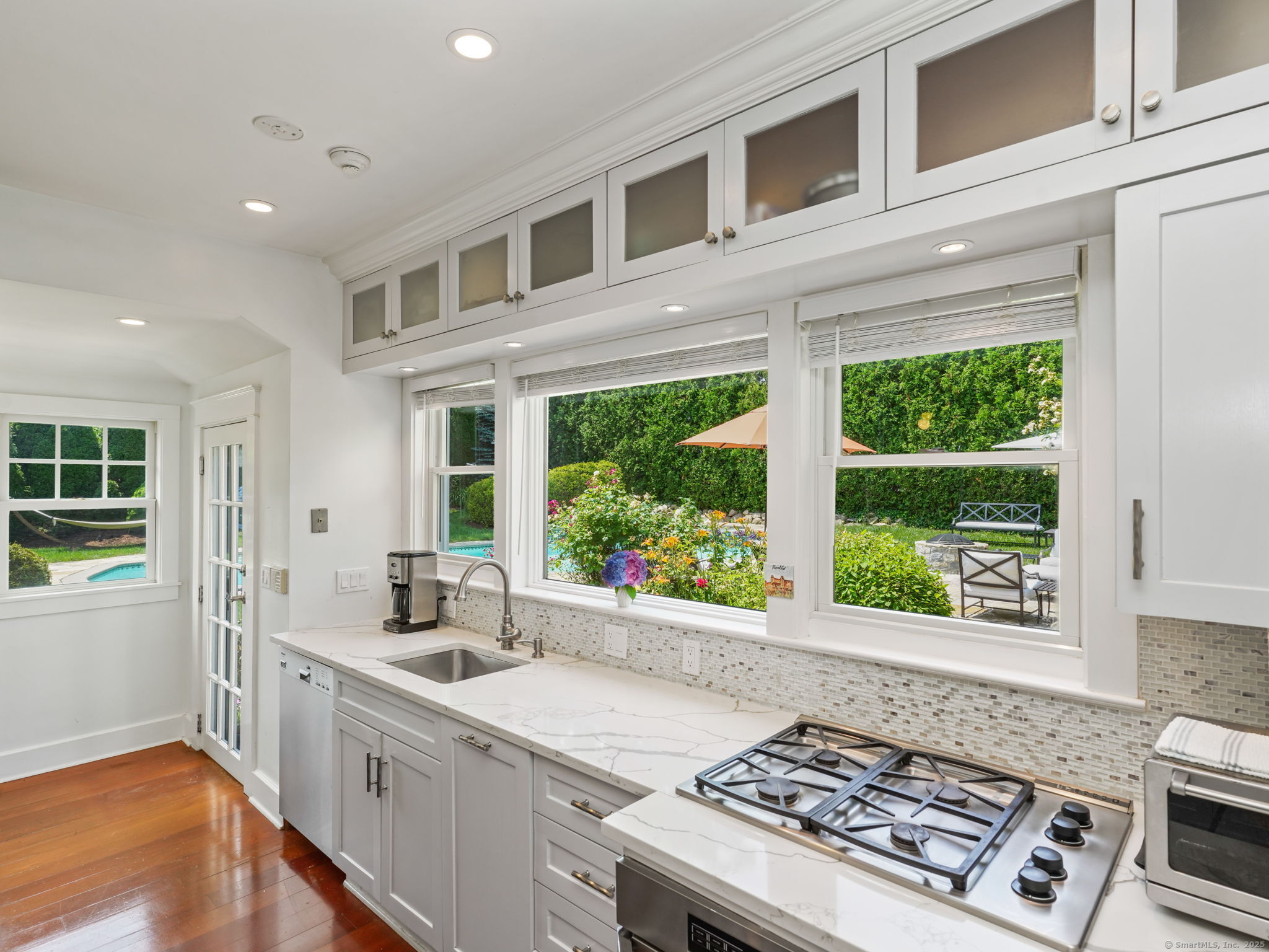 23 Auldwood Road Stamford, CT 06902 - Photo 13 of 39 huge kitchen window has beautiful view of the pool and patio