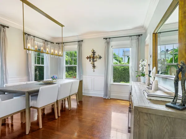 a view of a dining room with furniture window and wooden floor