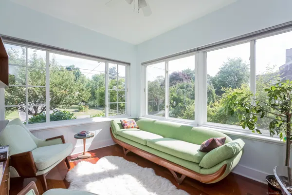 a living room with furniture and a large window