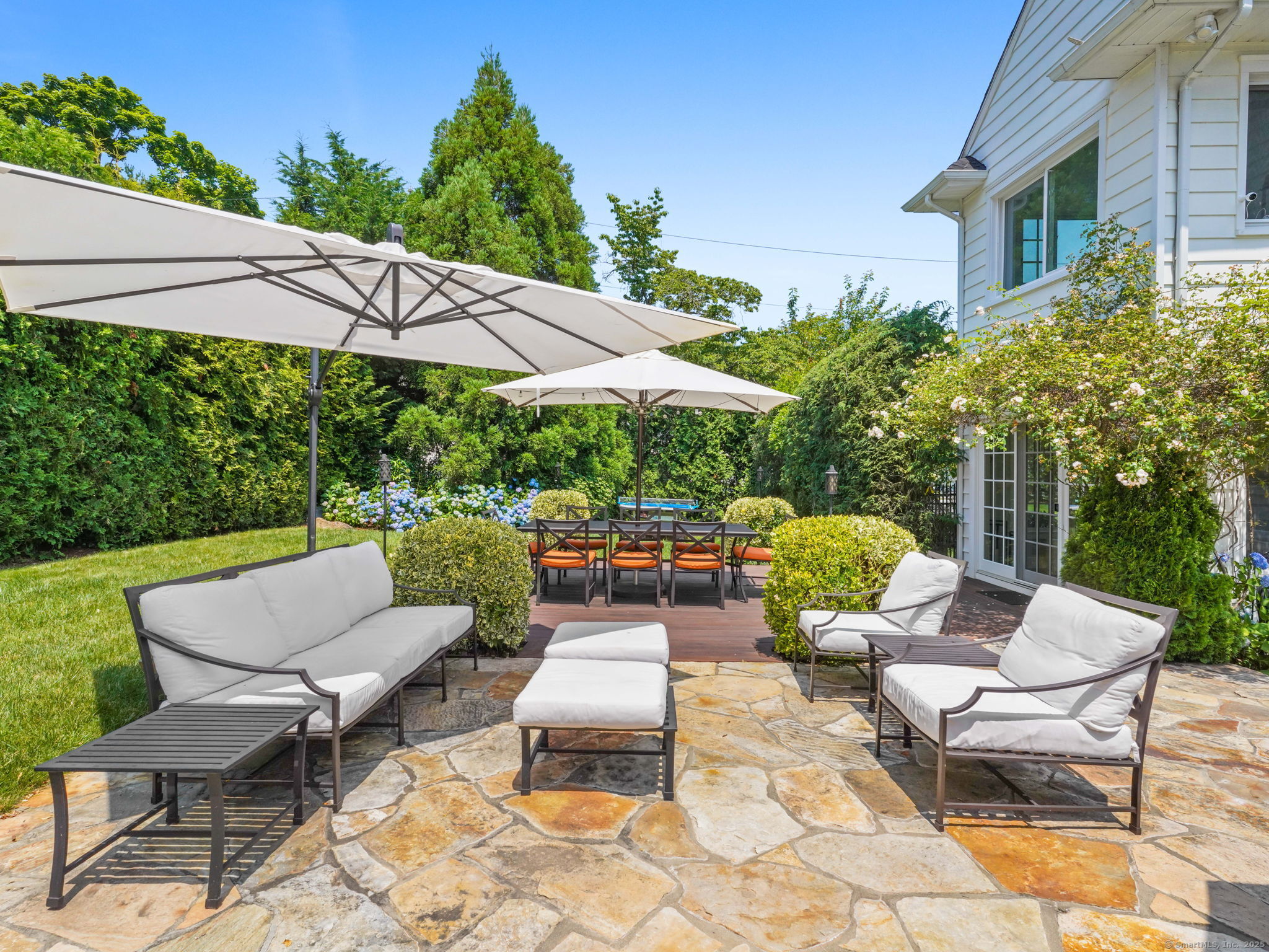 23 Auldwood Road Stamford, CT 06902 - Photo 26 of 39 out door kitchen framed by thriving rose trellis