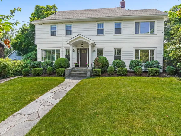 a bathroom with a sink toilet and window
