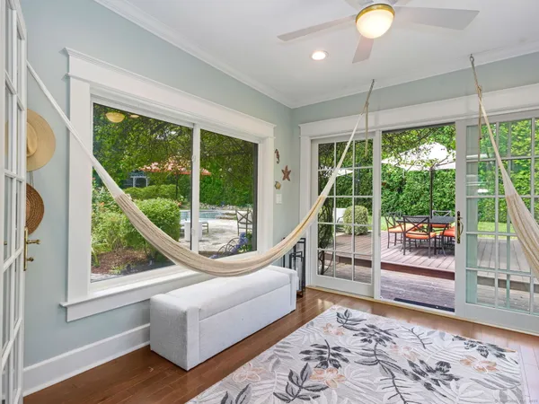 a living room with couch and a floor to ceiling window