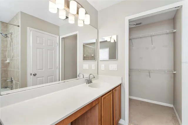 a bathroom with a sink a vanity and a mirror