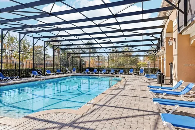 a view of a swimming pool with a patio