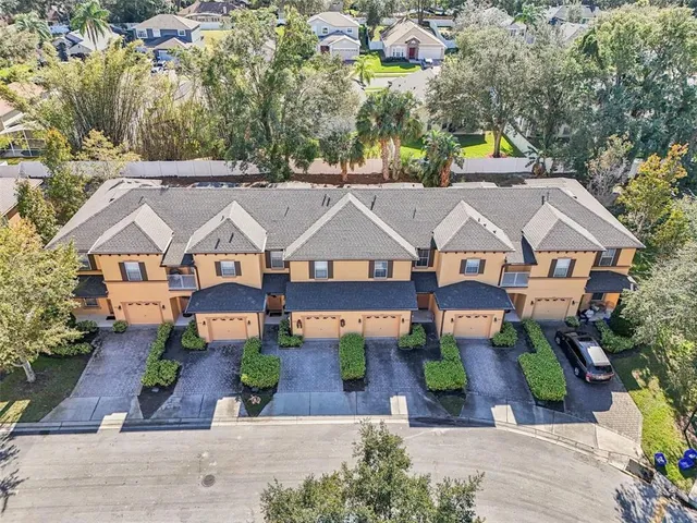 an aerial view of a house with a garden