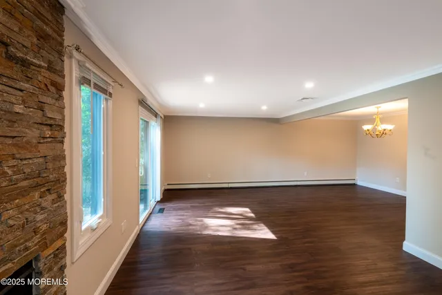 a view of gallery with wooden floor
