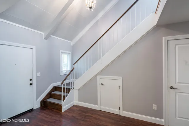 a view of entryway with wooden floor