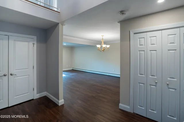 an empty room with wooden floor