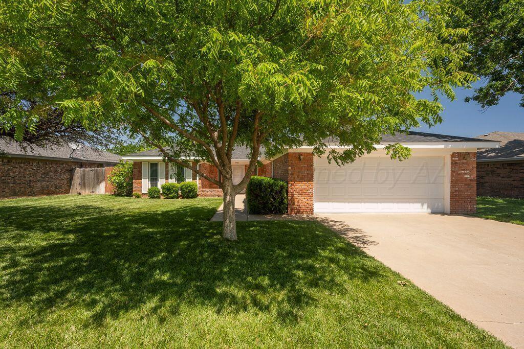 7935 Mitcham Drive Amarillo, TX 79121 - Photo 1 of 20 a front view of a house with a yard