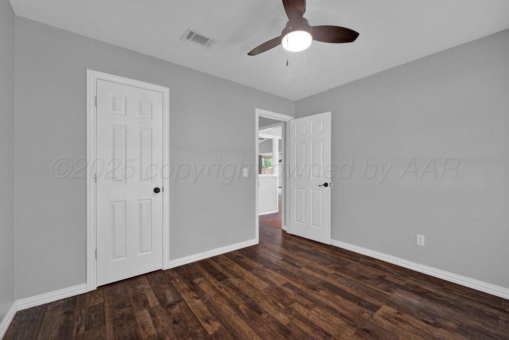 7935 Mitcham Drive Amarillo, TX 79121 - Photo 13 of 20 a view of an empty room with wooden floor