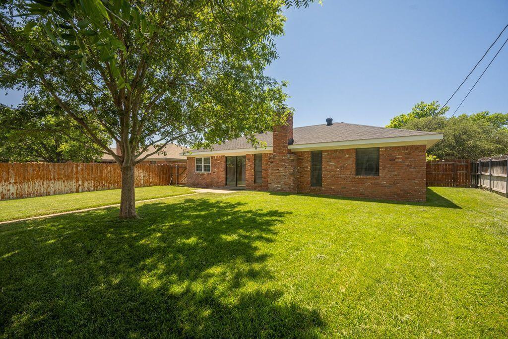 7935 Mitcham Drive Amarillo, TX 79121 - Photo 17 of 20 a house with a tree in front of it