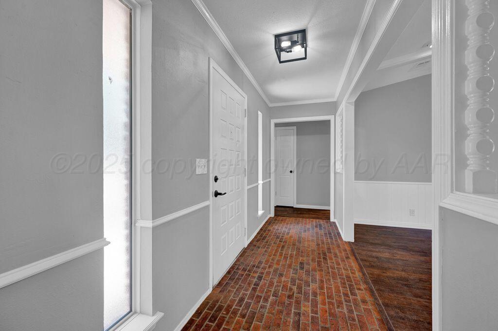 7935 Mitcham Drive Amarillo, TX 79121 - Photo 2 of 20 a view of hallway with wooden floor