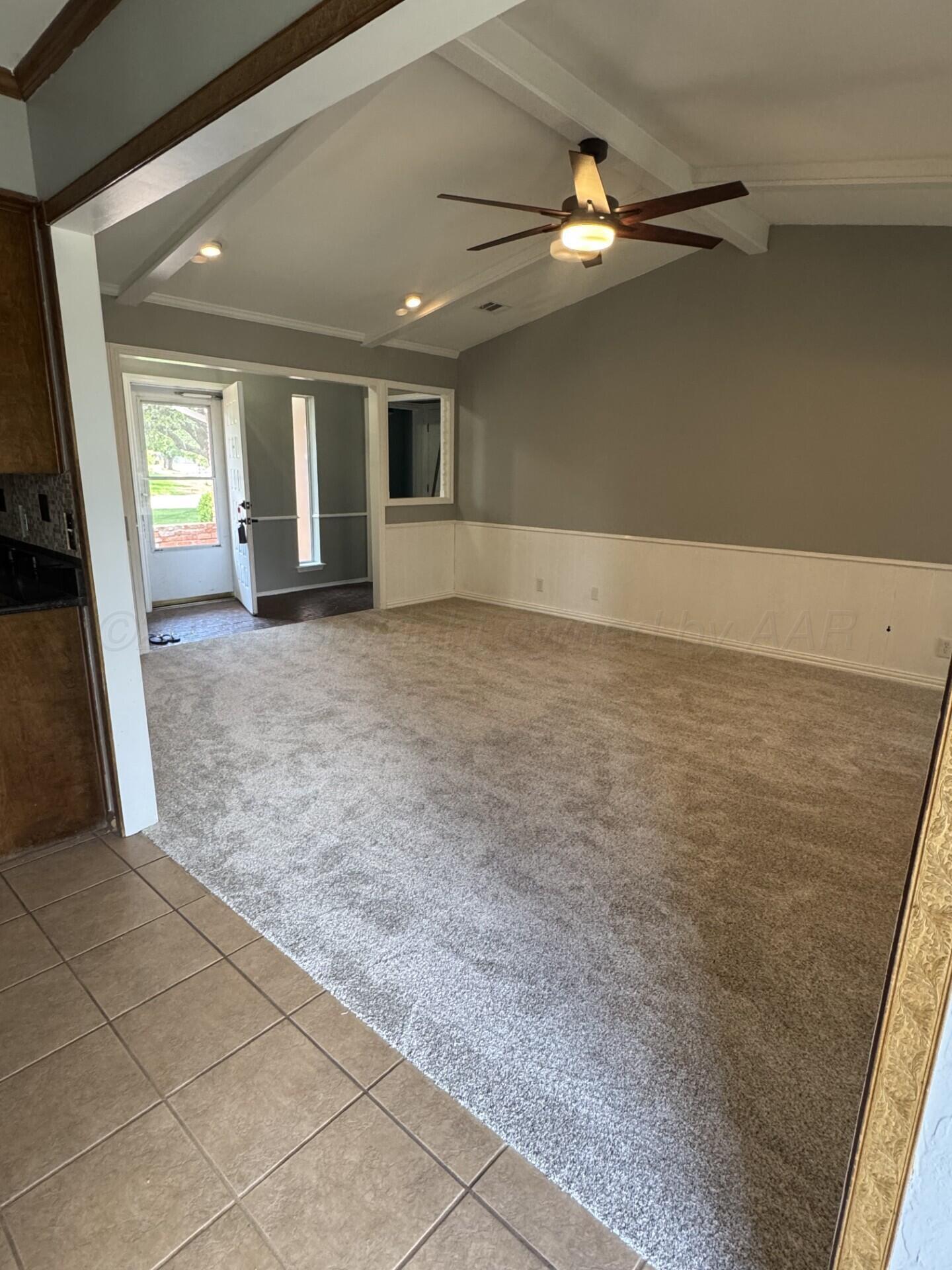 7935 Mitcham Drive Amarillo, TX 79121 - Photo 5 of 20 a view of a livingroom with a ceiling fan and window