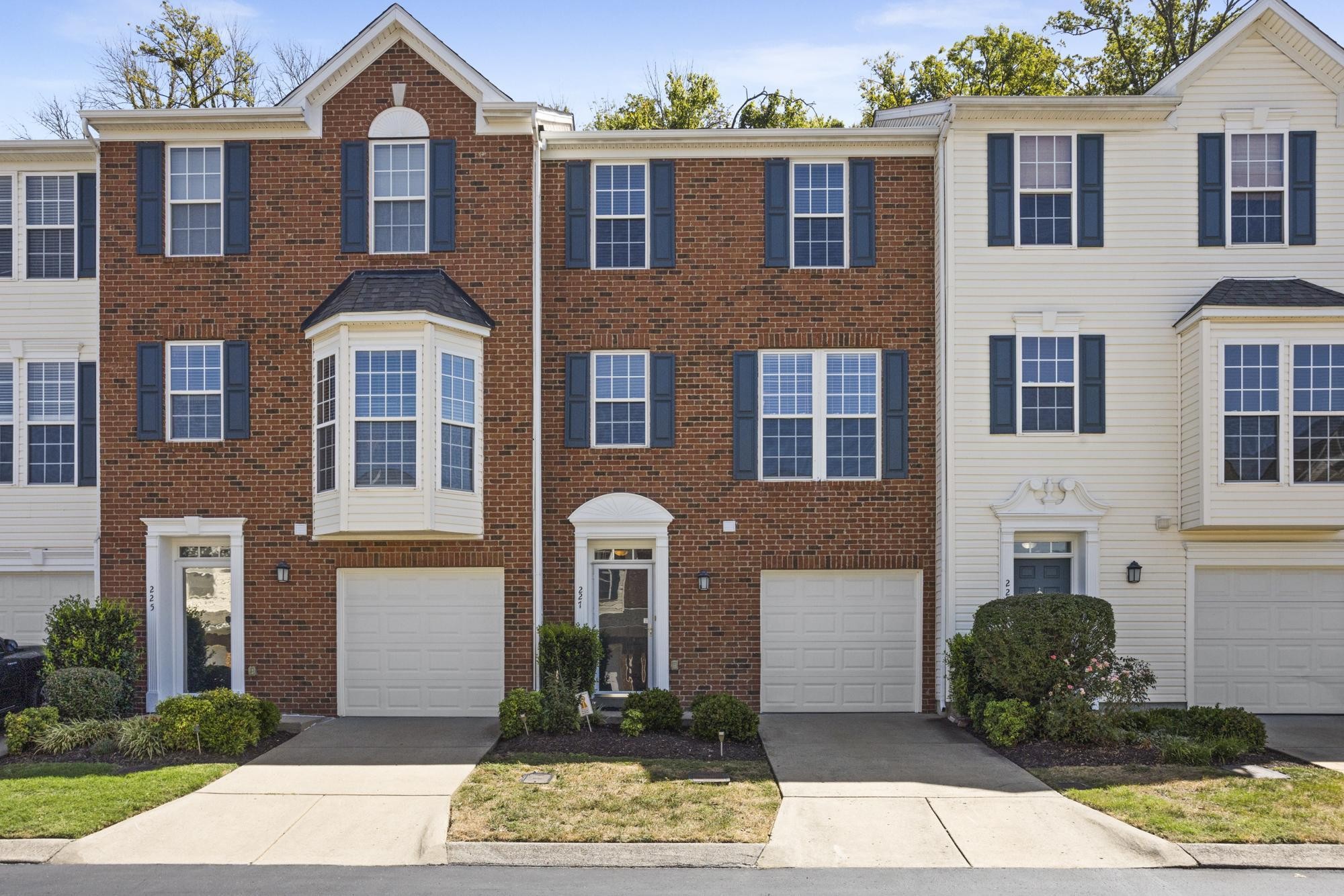 7277 Charlotte Pike, Unit 227 Nashville, TN 37209 - Photo 1 of 36 a front view of a house with garden