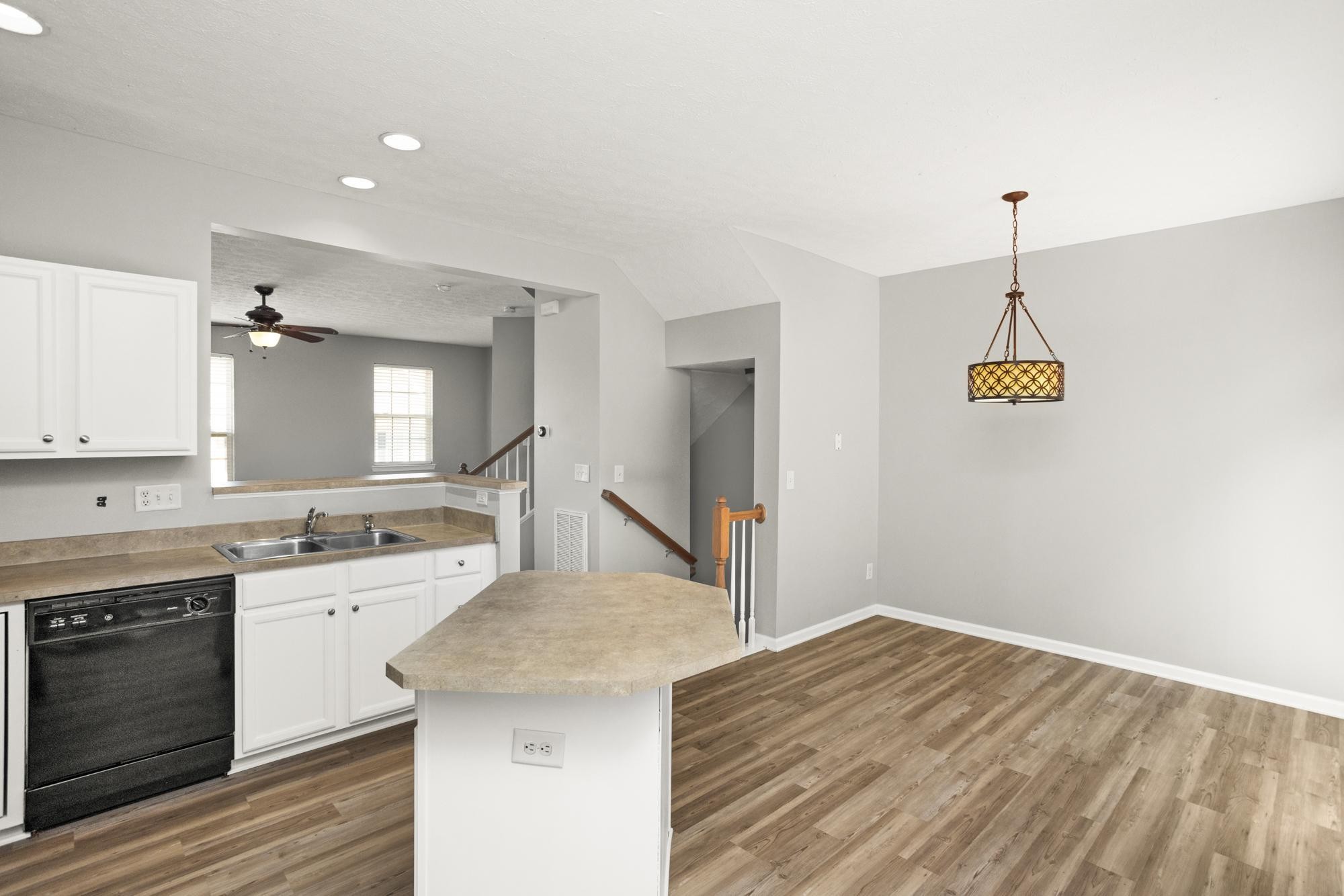 7277 Charlotte Pike, Unit 227 Nashville, TN 37209 - Photo 14 of 36 a kitchen with a stove a sink and a refrigerator