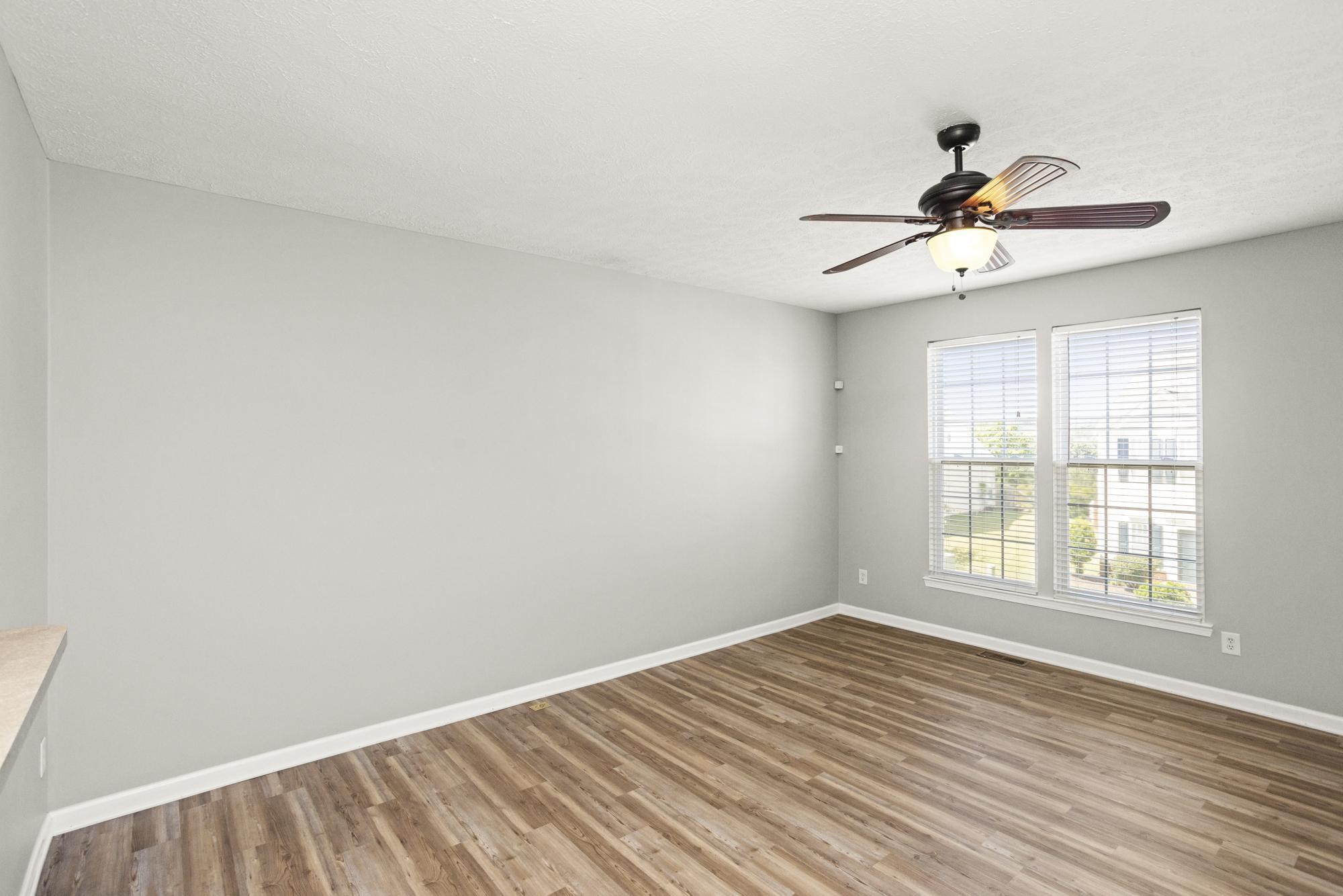 7277 Charlotte Pike, Unit 227 Nashville, TN 37209 - Photo 15 of 36 wooden floor in an empty room with a window