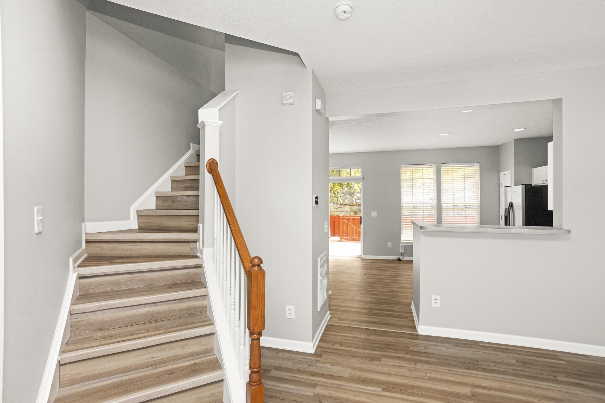 7277 Charlotte Pike, Unit 227 Nashville, TN 37209 - Photo 19 of 36 a view of an entryway with wooden floor and staircase