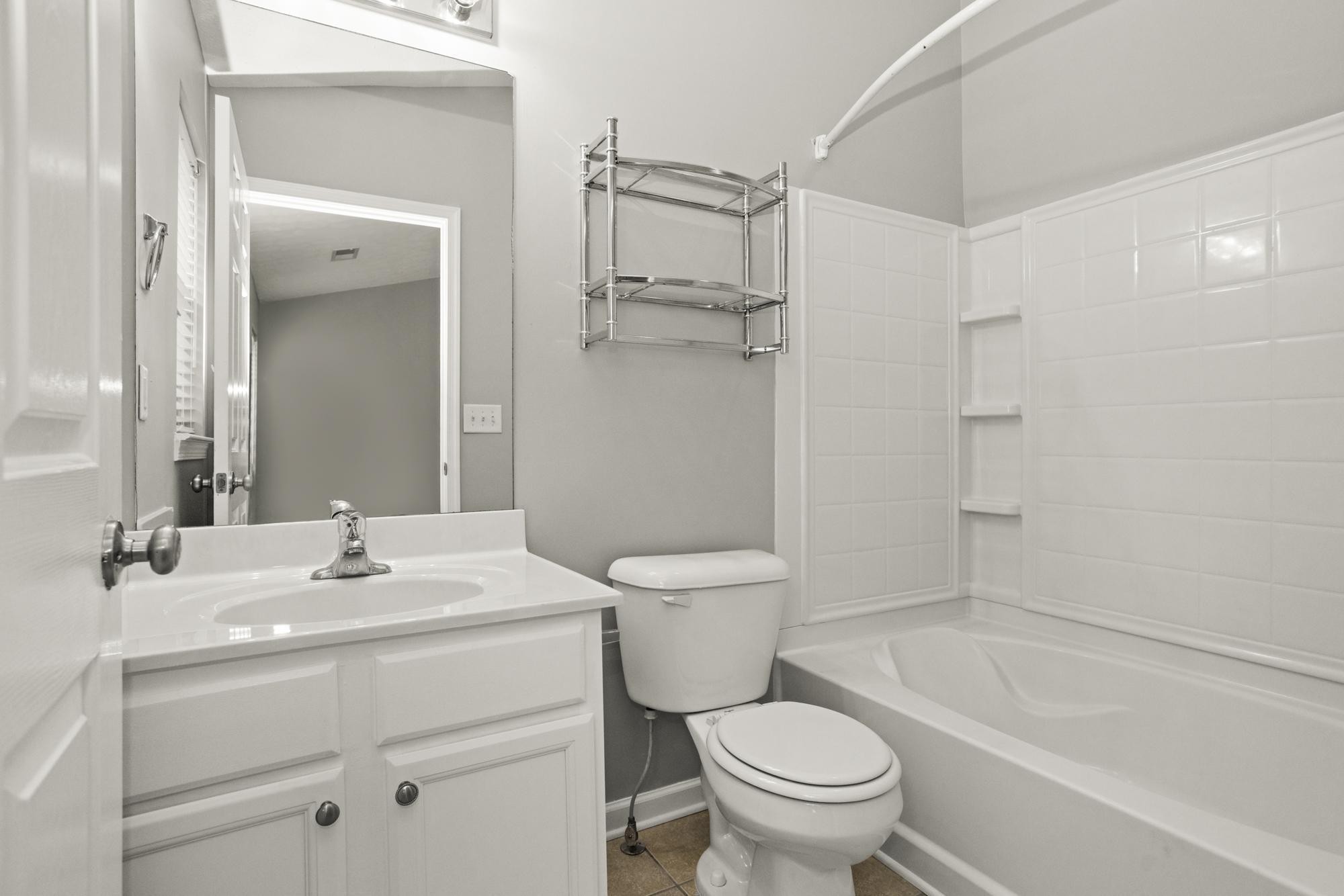 7277 Charlotte Pike, Unit 227 Nashville, TN 37209 - Photo 23 of 36 a bathroom with a sink toilet and shower