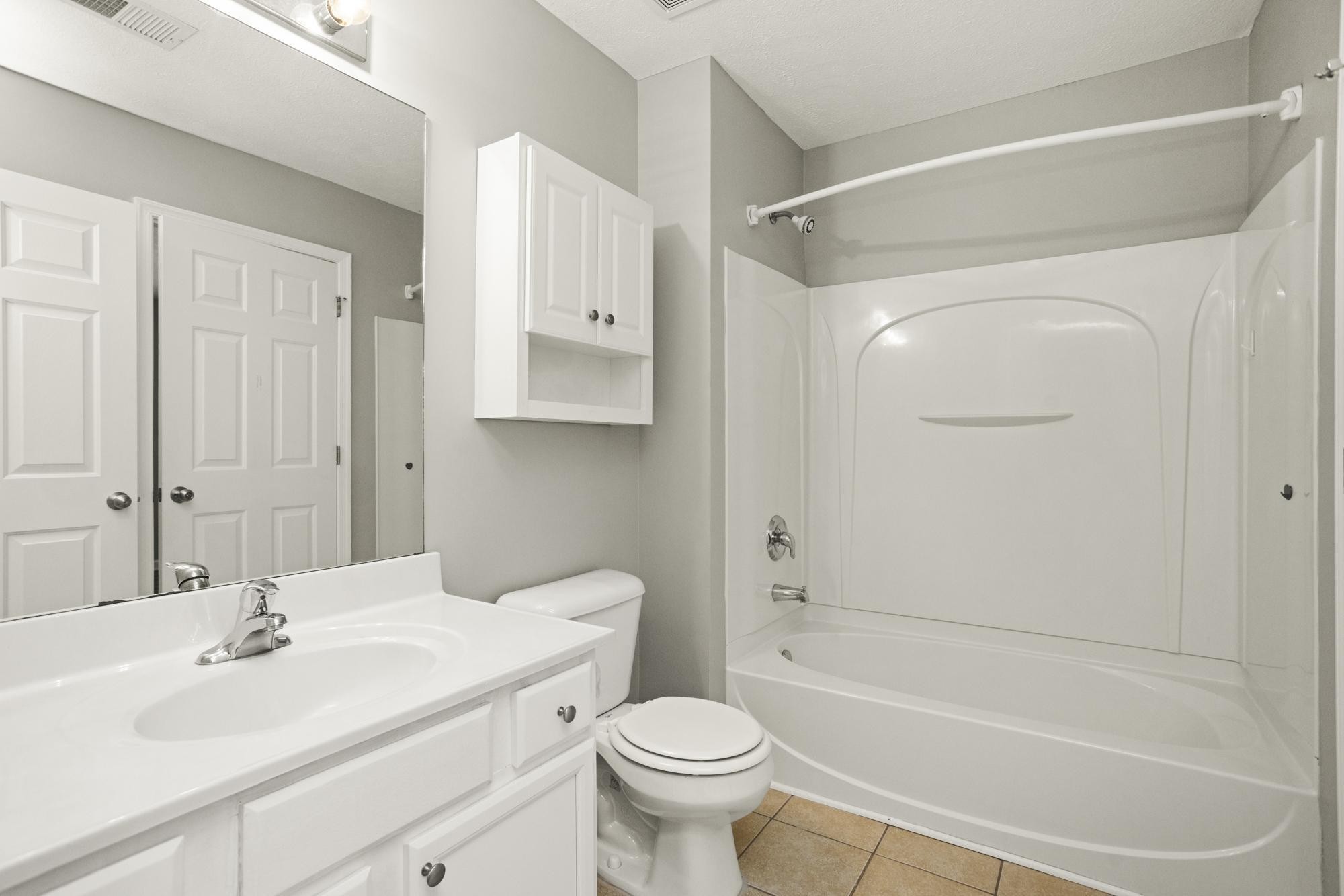 7277 Charlotte Pike, Unit 227 Nashville, TN 37209 - Photo 25 of 36 a bathroom with a sink toilet and shower
