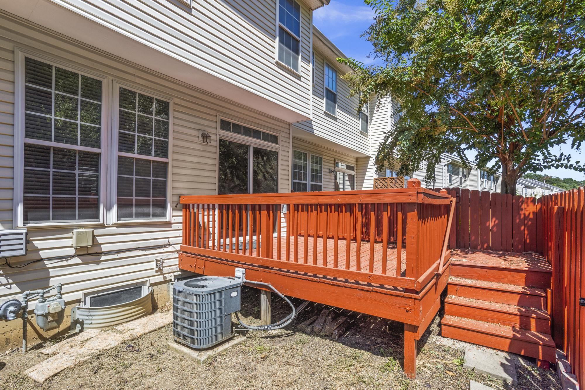 7277 Charlotte Pike, Unit 227 Nashville, TN 37209 - Photo 32 of 36 a porch with a bench next to a yard