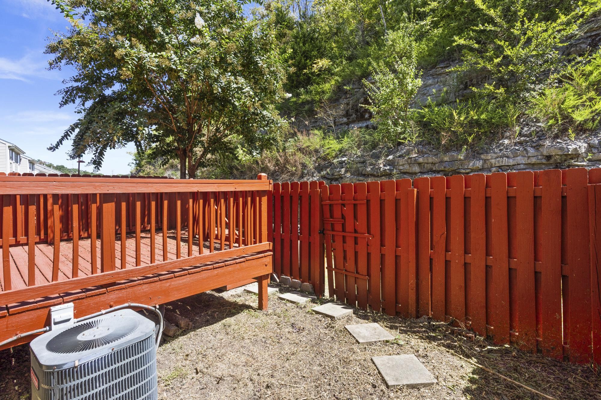 7277 Charlotte Pike, Unit 227 Nashville, TN 37209 - Photo 33 of 36 a wooden bench sitting in a backyard