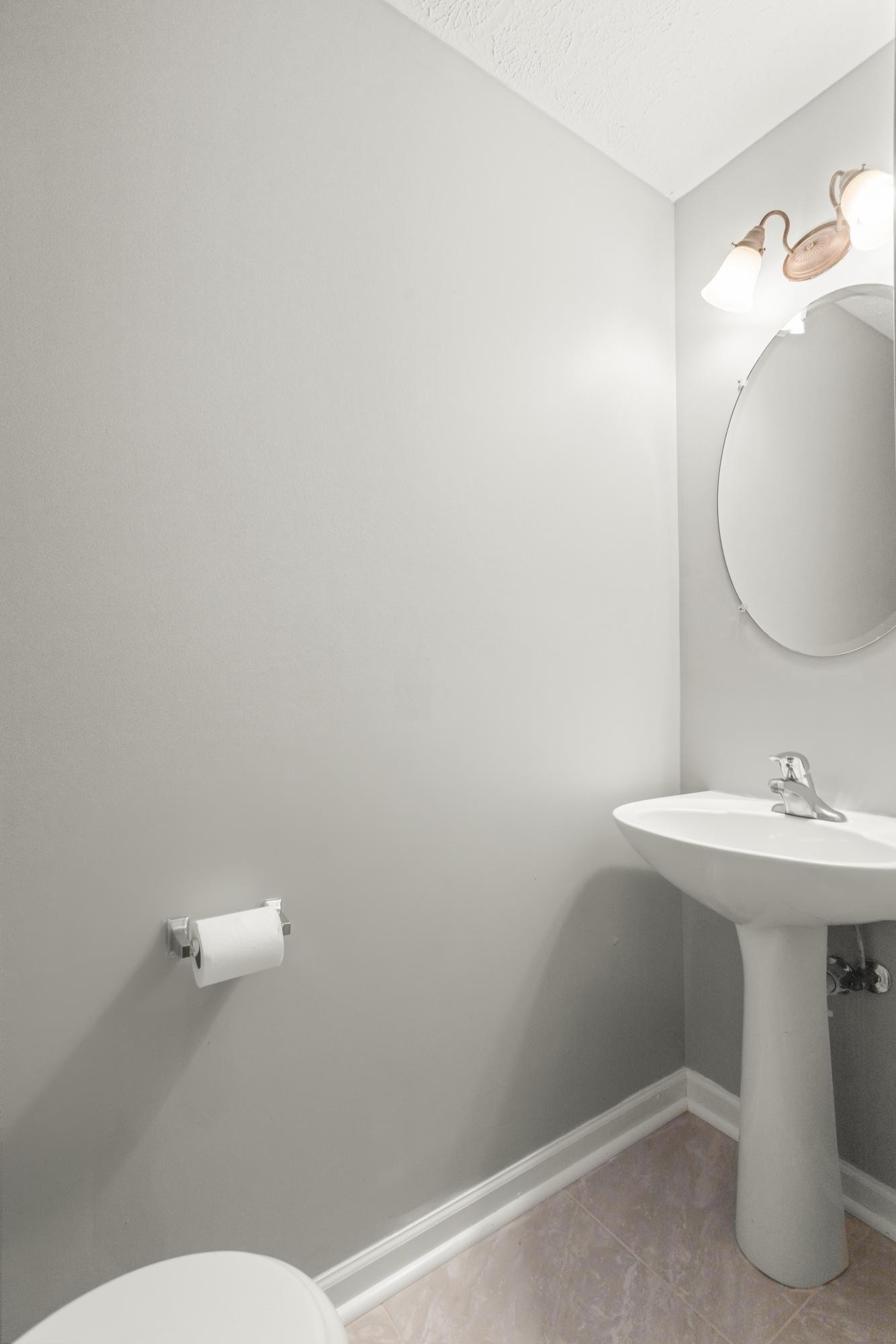 7277 Charlotte Pike, Unit 227 Nashville, TN 37209 - Photo 35 of 36 a bathroom with a sink mirror and toilet