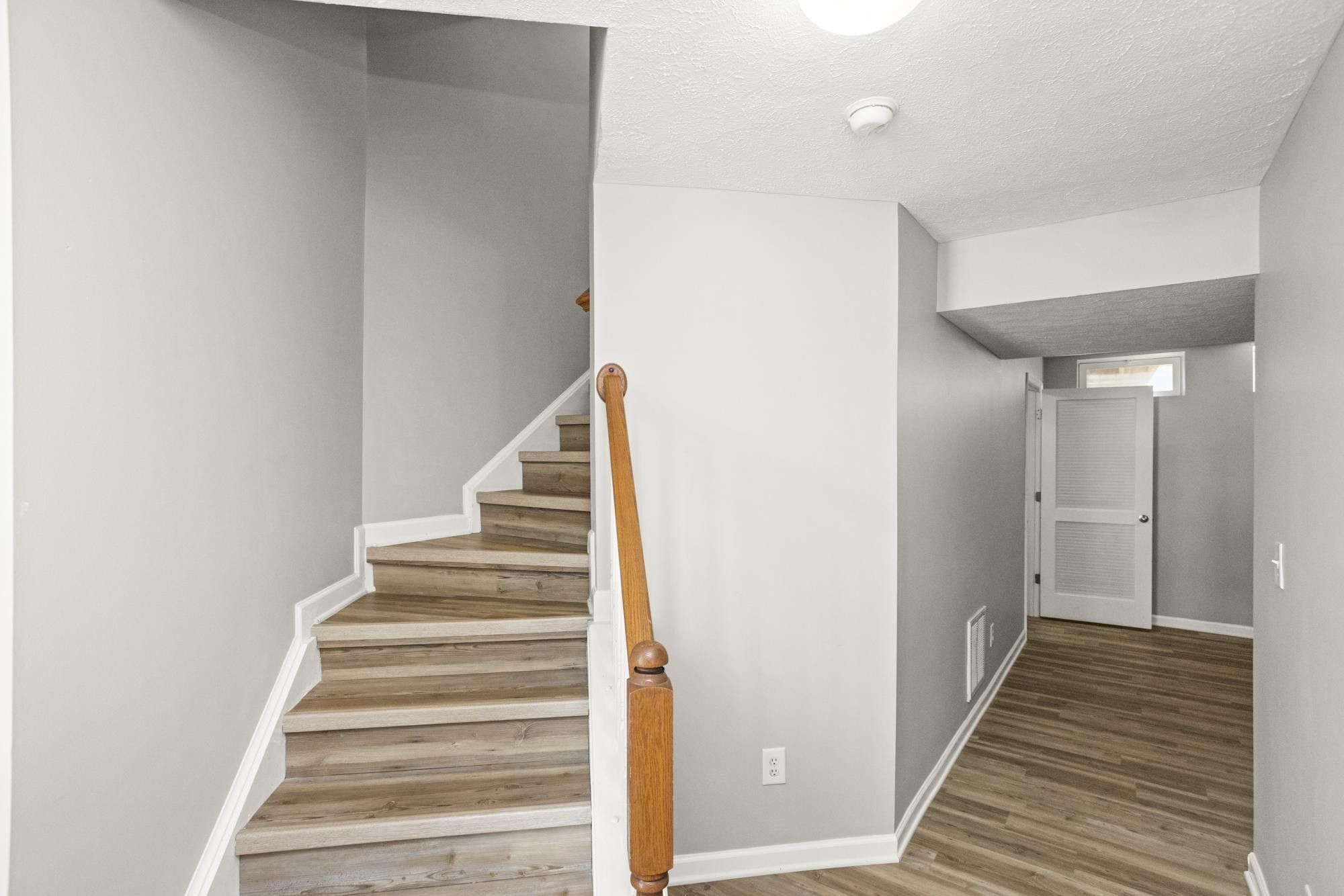 7277 Charlotte Pike, Unit 227 Nashville, TN 37209 - Photo 4 of 36 a view of a hallway with wooden floor and entryway