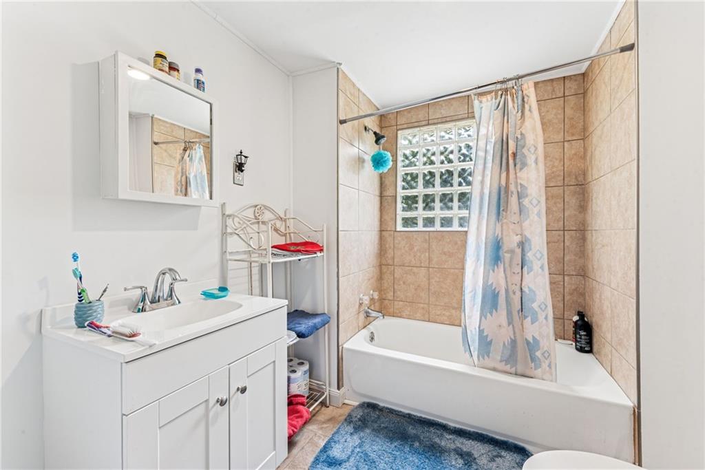 1110 Ross Mountain Park Road New Florence, PA 15944 - Photo 12 of 24 a bathroom with a tub sink and a mirror