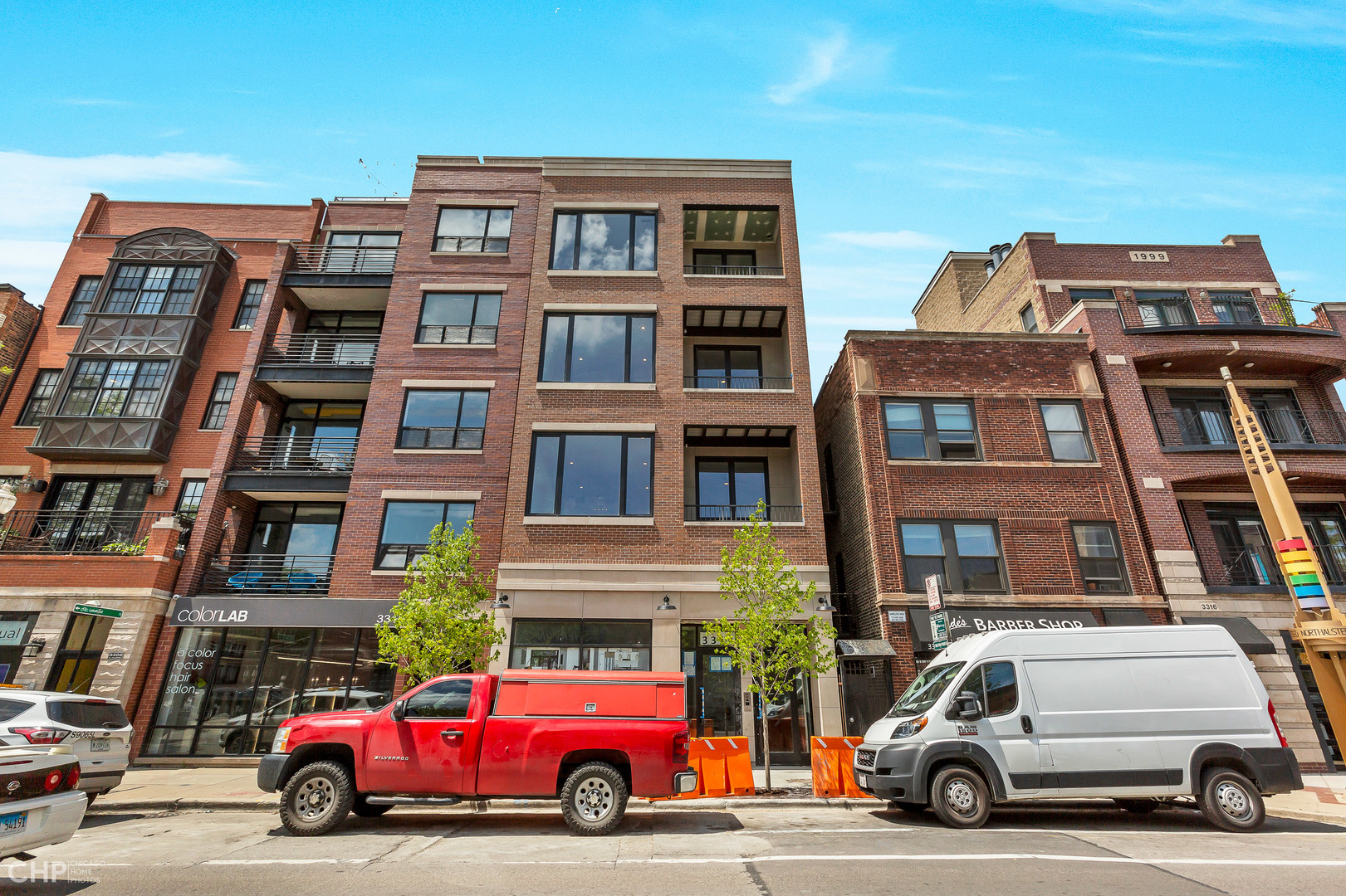 3312 North Halsted Street, Unit 2F Chicago, IL 60657 - Photo 1 of 17 a car parked in front of a building