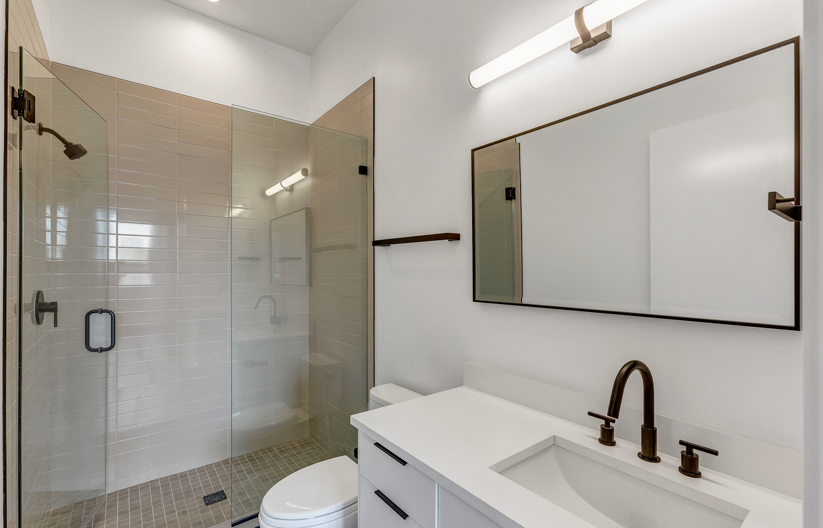 3312 North Halsted Street, Unit 2F Chicago, IL 60657 - Photo 12 of 17 a bathroom with a sink toilet and shower