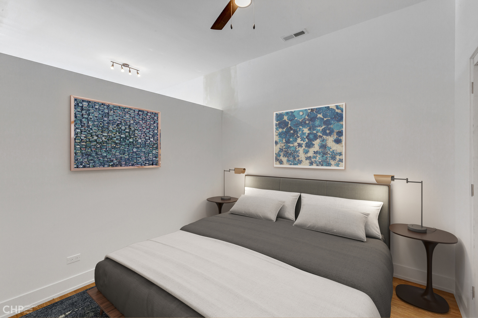 3312 North Halsted Street, Unit 2F Chicago, IL 60657 - Photo 14 of 17 a bedroom with a bed and a painting on the wall