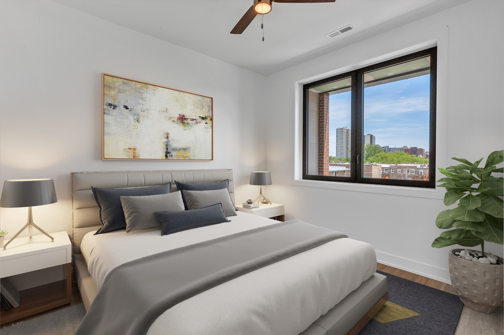 3312 North Halsted Street, Unit 2F Chicago, IL 60657 - Photo 17 of 17 a bedroom with a large bed and a potted plant