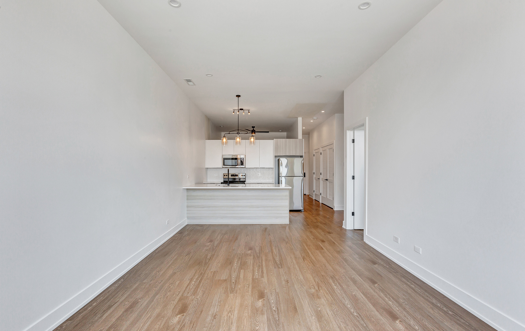 3312 North Halsted Street, Unit 2F Chicago, IL 60657 - Photo 4 of 17 a view of a kitchen with wooden floor