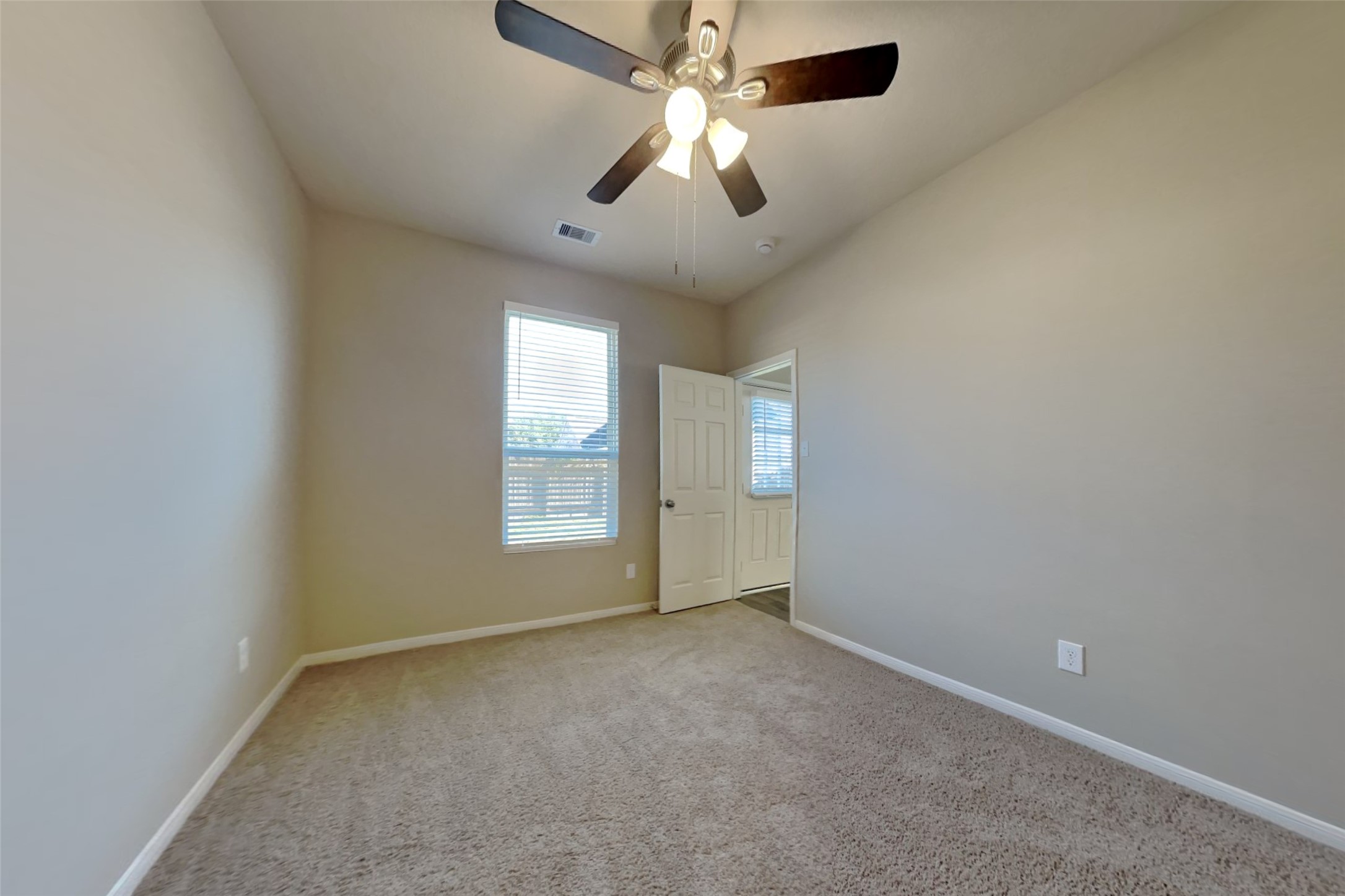 2411 Lofty Falls Court Spring, TX 77386 - Photo 15 of 23 an empty room with windows and fan