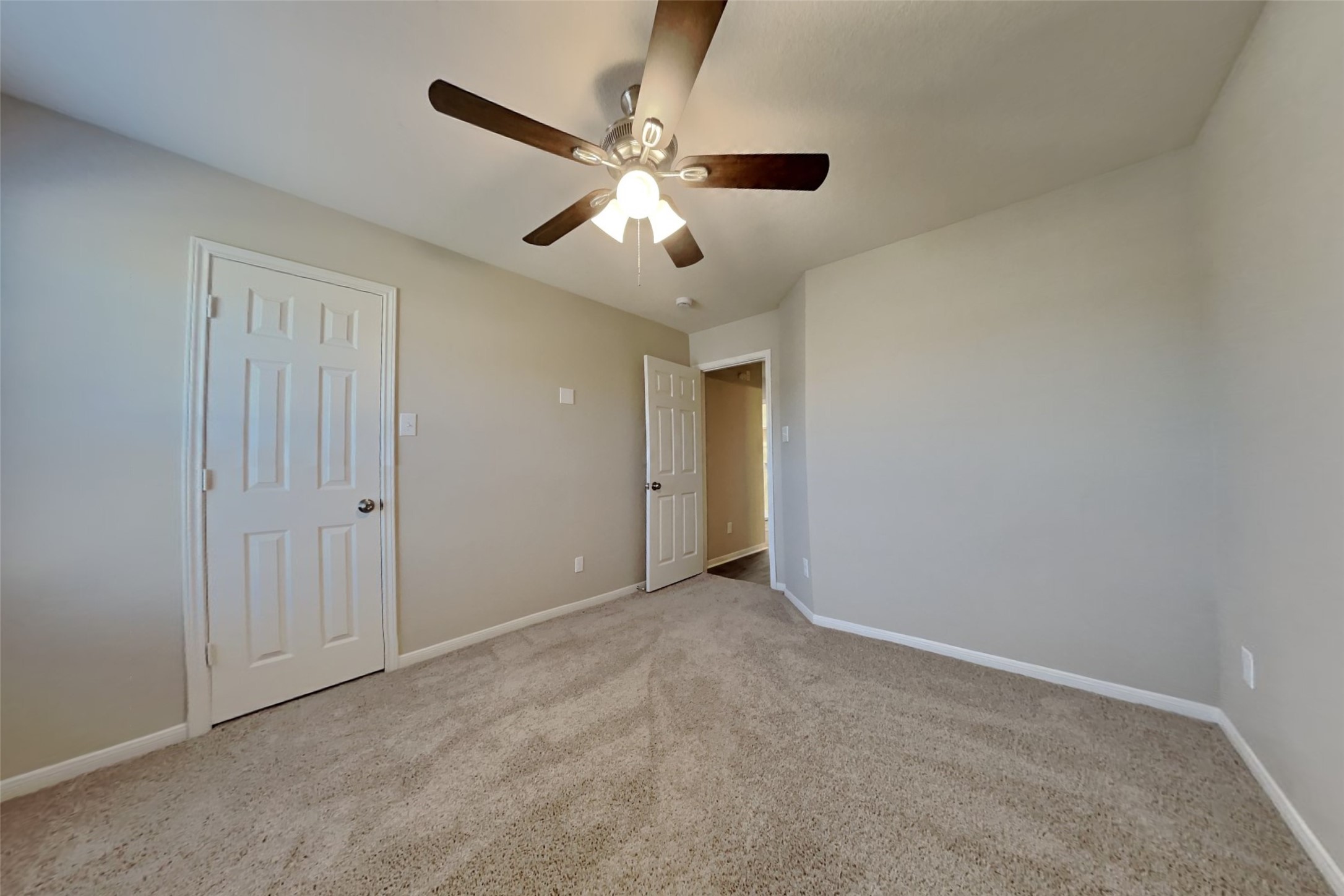 2411 Lofty Falls Court Spring, TX 77386 - Photo 18 of 23 an empty room with closet and a ceiling fan