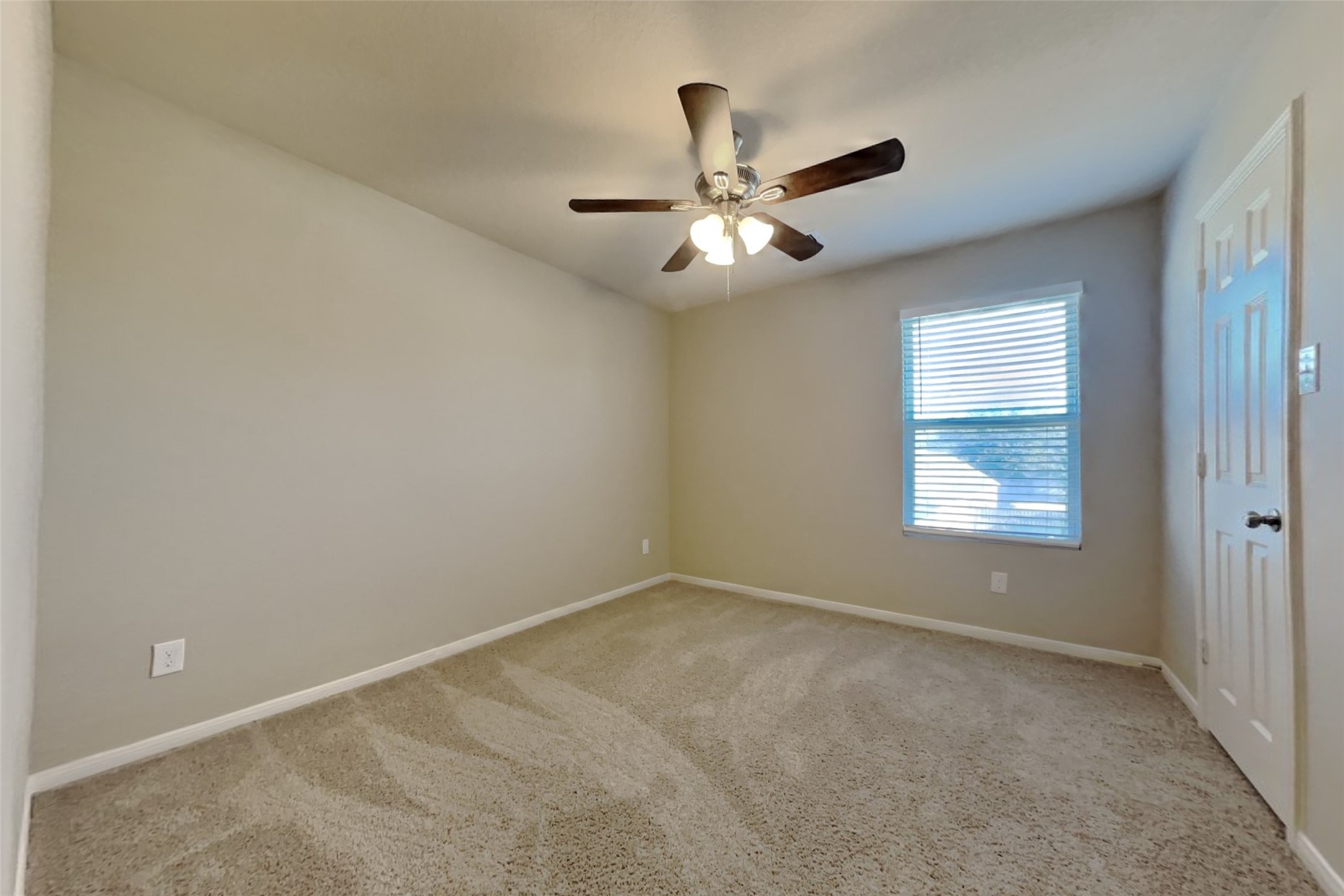 2411 Lofty Falls Court Spring, TX 77386 - Photo 19 of 23 an empty room with windows and fan