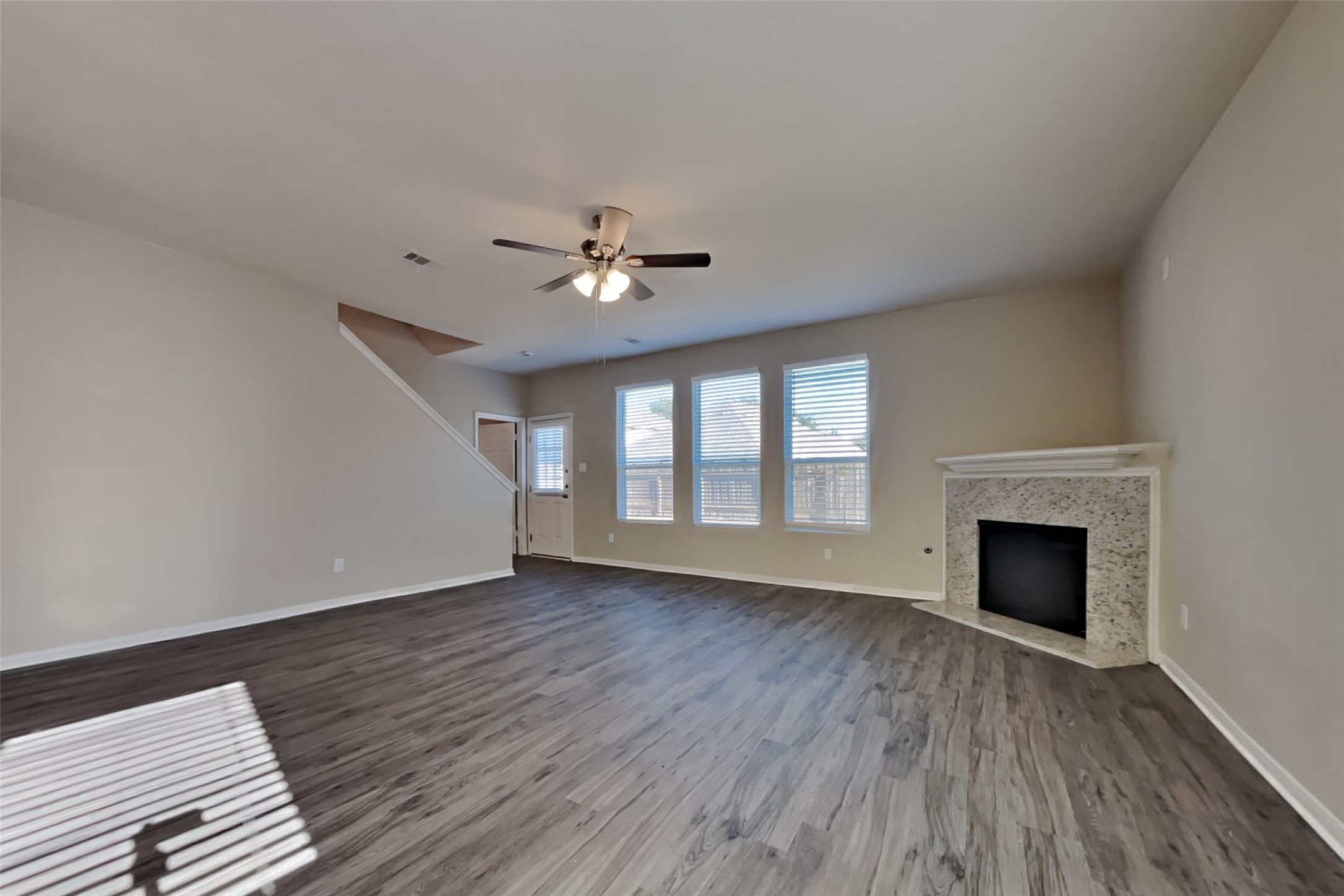 2411 Lofty Falls Court Spring, TX 77386 - Photo 2 of 23 wooden floor fireplace and windows in an empty room