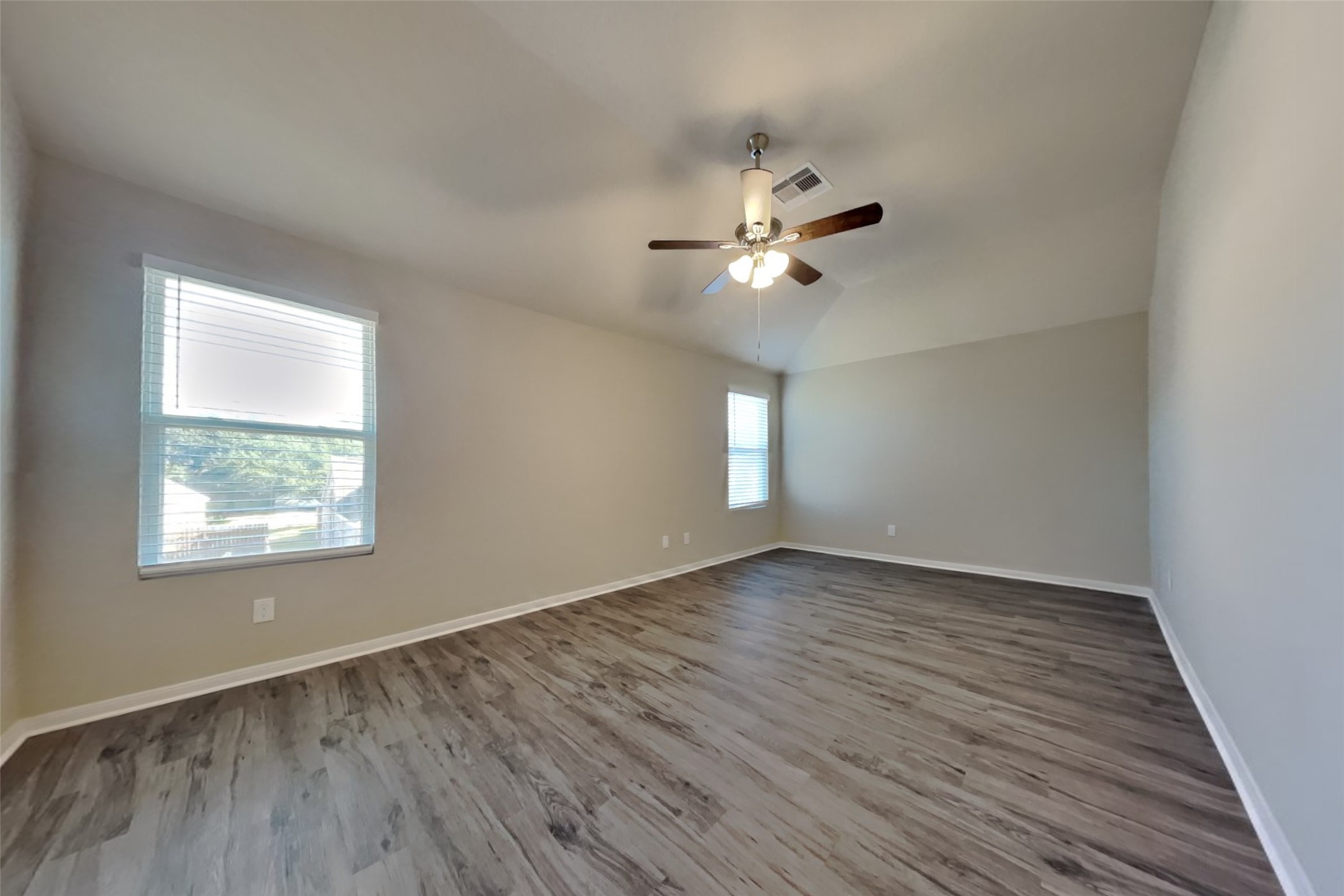 2411 Lofty Falls Court Spring, TX 77386 - Photo 4 of 23 an empty room with wooden floor and window