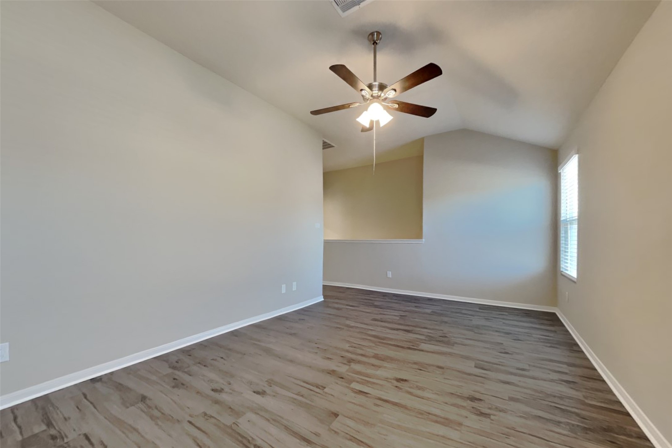 2411 Lofty Falls Court Spring, TX 77386 - Photo 5 of 23 a view of an empty room with wooden floor