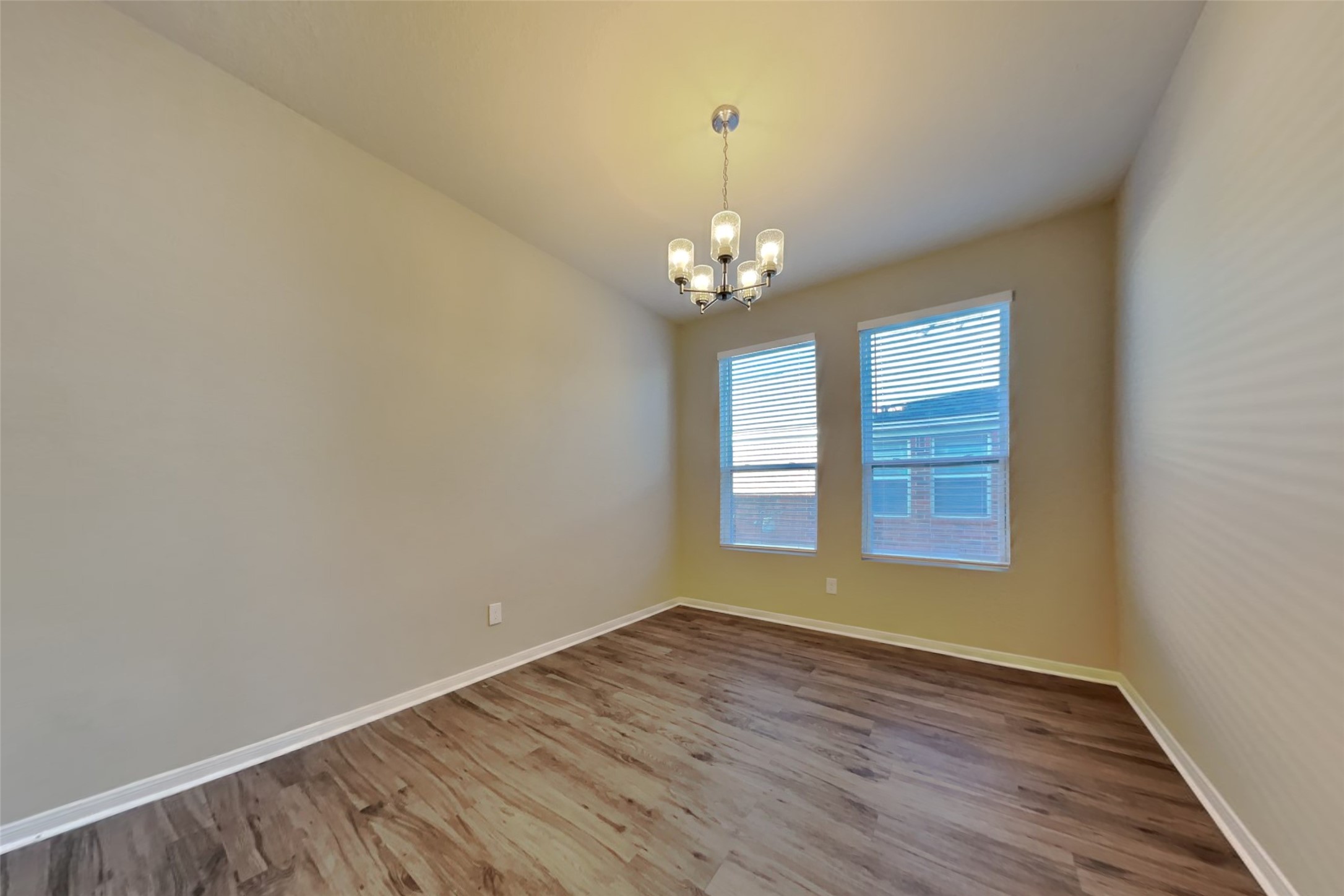 2411 Lofty Falls Court Spring, TX 77386 - Photo 9 of 23 a view of empty room with wooden floor and window